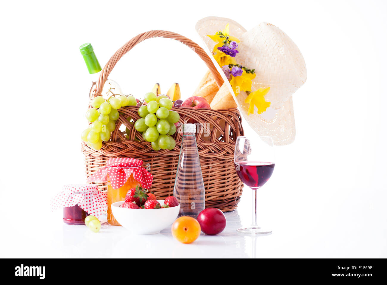 picnic basket with wine, fruit and bread Stock Photo - Alamy