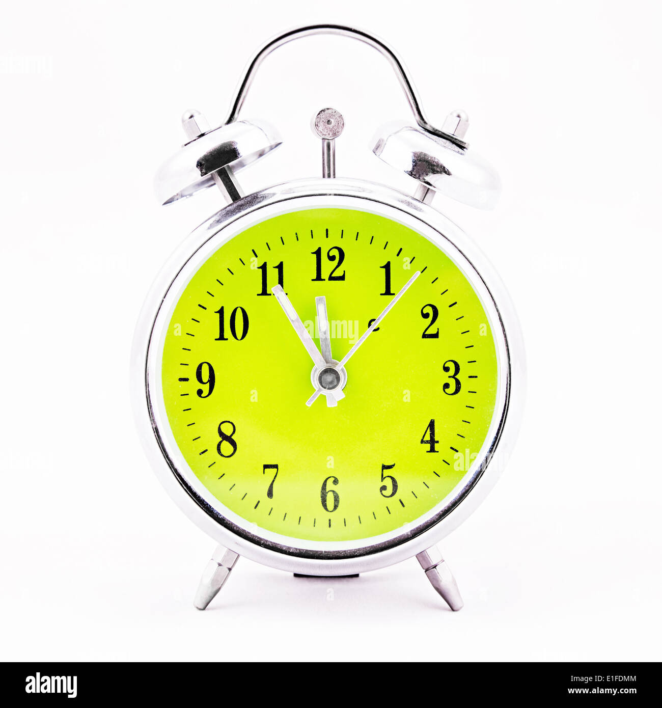 Alarm clock on white background. Showing time five minutes before twelve Stock Photo