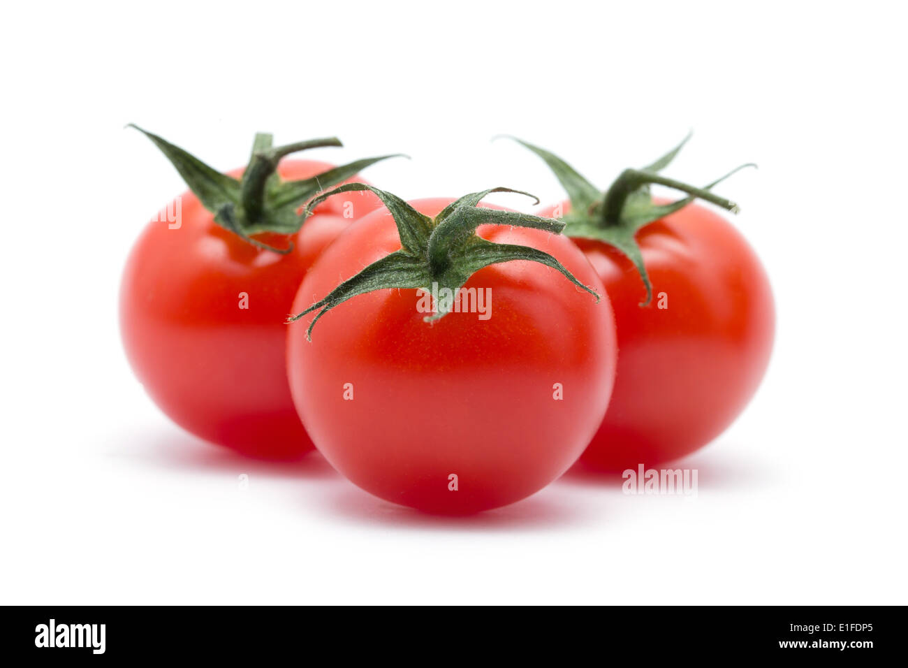 Cherry tomatoes on white Stock Photo