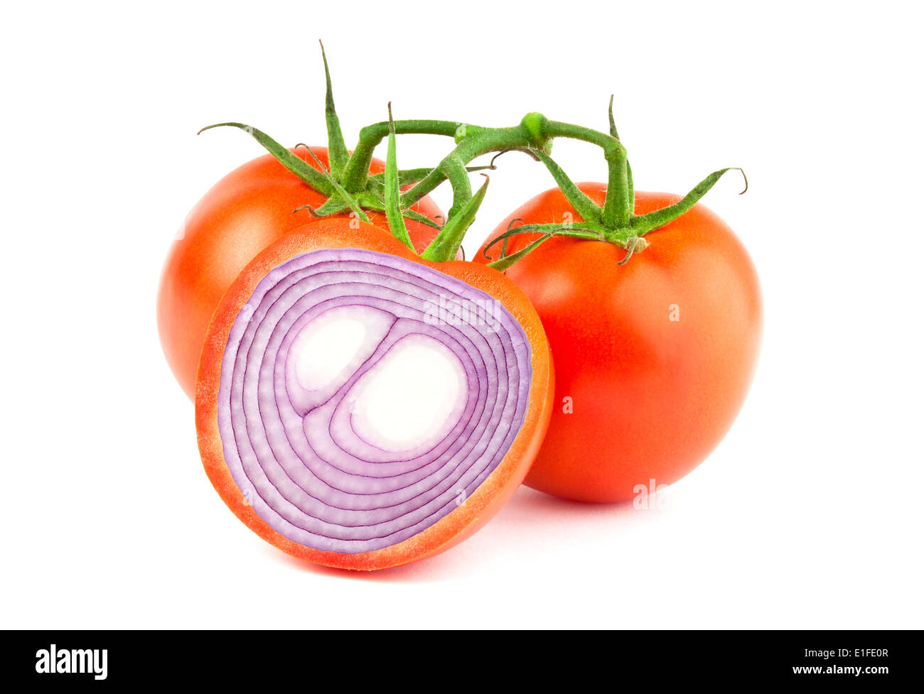 Manipulated image of sliced tomato with red onion inside Stock Photo