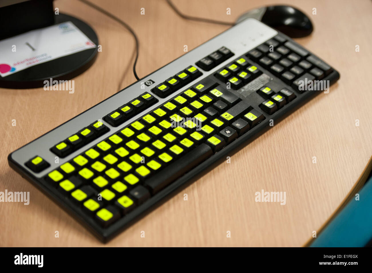 Computer keyboard with highlighted keys to aid visually impaired people. Stock Photo