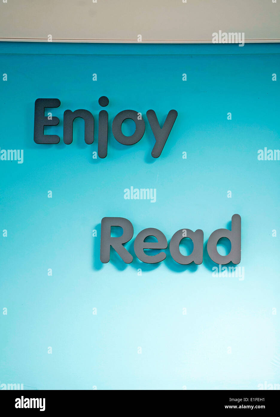 Enjoy Read sign in library. Stock Photo