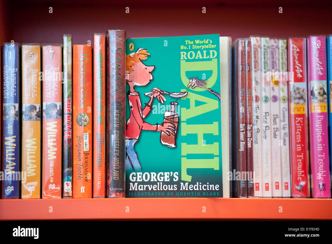 Roald Dahl book names 'George's Marvellous Medicine' on shelf of a library. Stock Photo