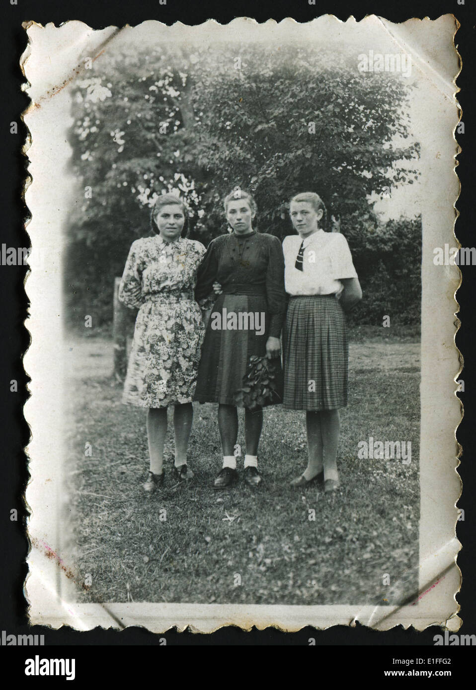 USSR - CIRCA 1950s: An antique photo shows three women in the garden Stock Photo