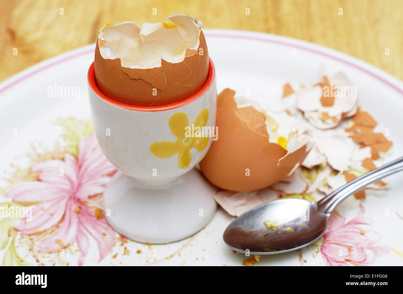 boiled egg shells with egg cup and spoon Stock Photo Alamy
