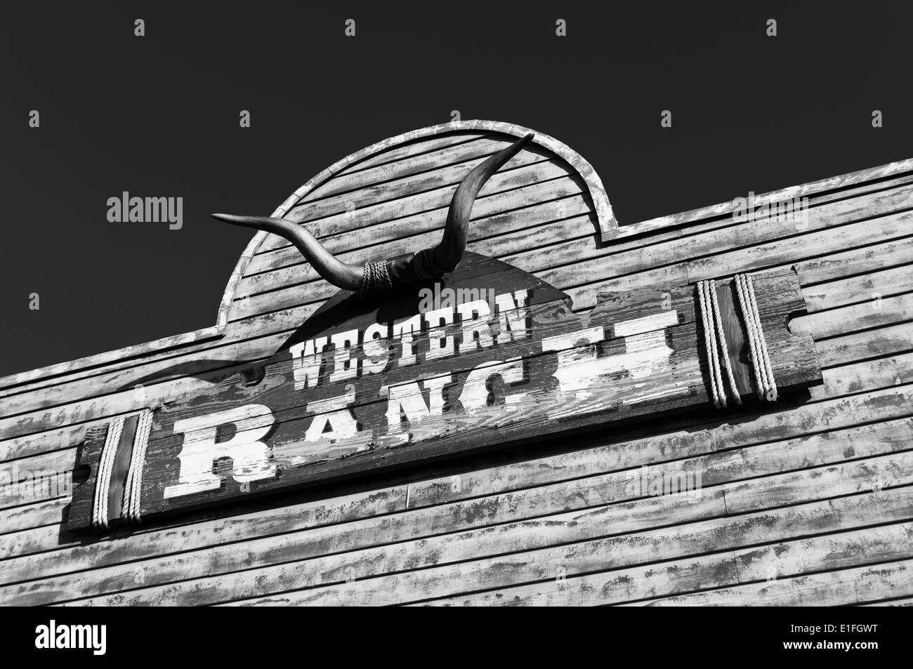 bull skull and western ranch board on a wooden facade Stock Photo