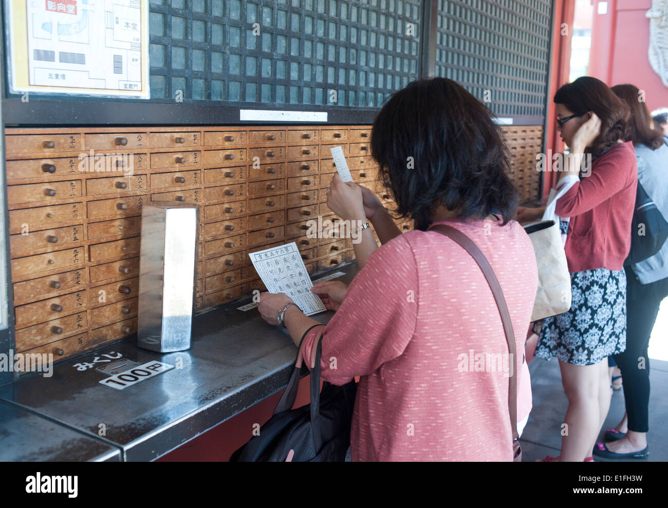 Tokyo Japan - Asakusa People take horoscope out of wooden drawer at Sanja Matsuri, Asakusa, Tokyo, Japan Stock Photo