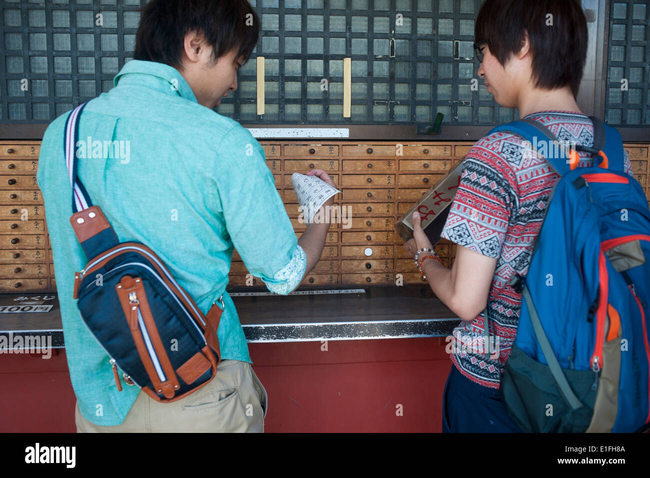 Tokyo Japan - Asakusa People take horoscope out of wooden drawer at Sanja Matsuri, Asakusa, Tokyo, Japan Stock Photo