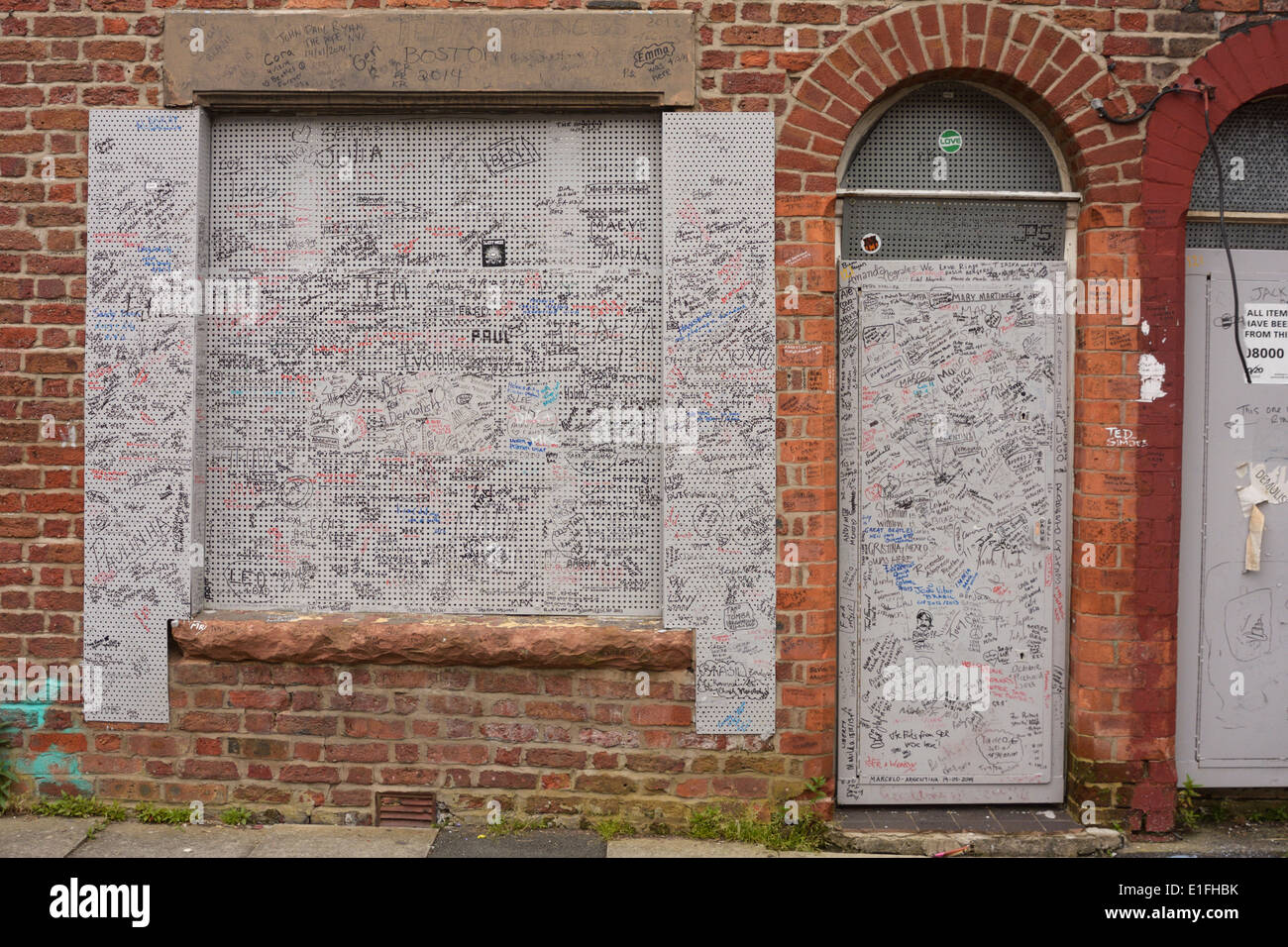 Beatles fans from around the world have signed the steel shutters on Ringos old home in Madryn Street, Liverpool. Stock Photo