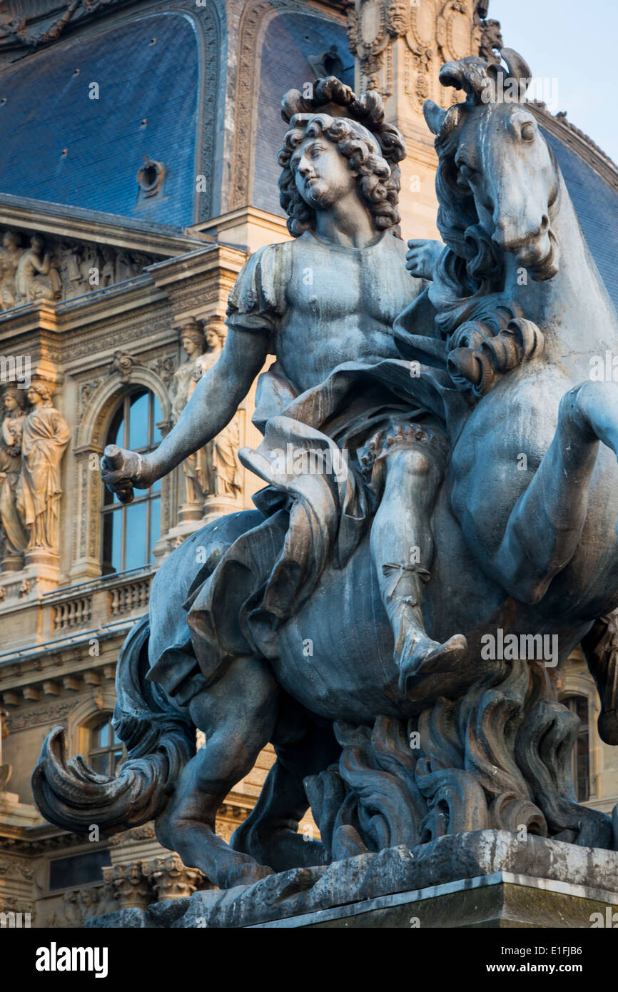 Statue of Louis XIV in the courtyard of Musee du Louvre, Paris France Stock Photo