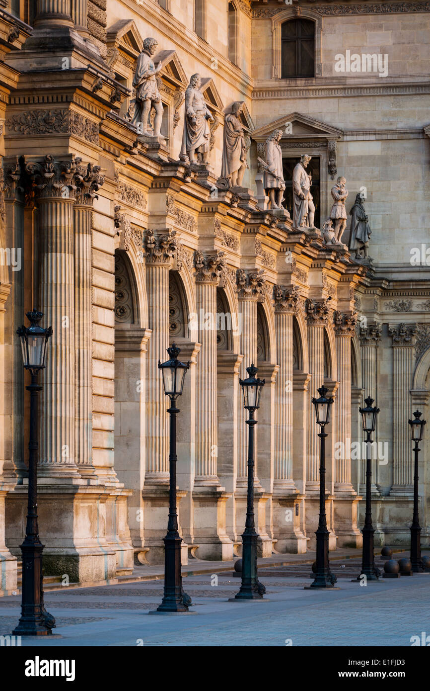 Row of lampposts against the architecture of Musee du Louvre, Paris France Stock Photo