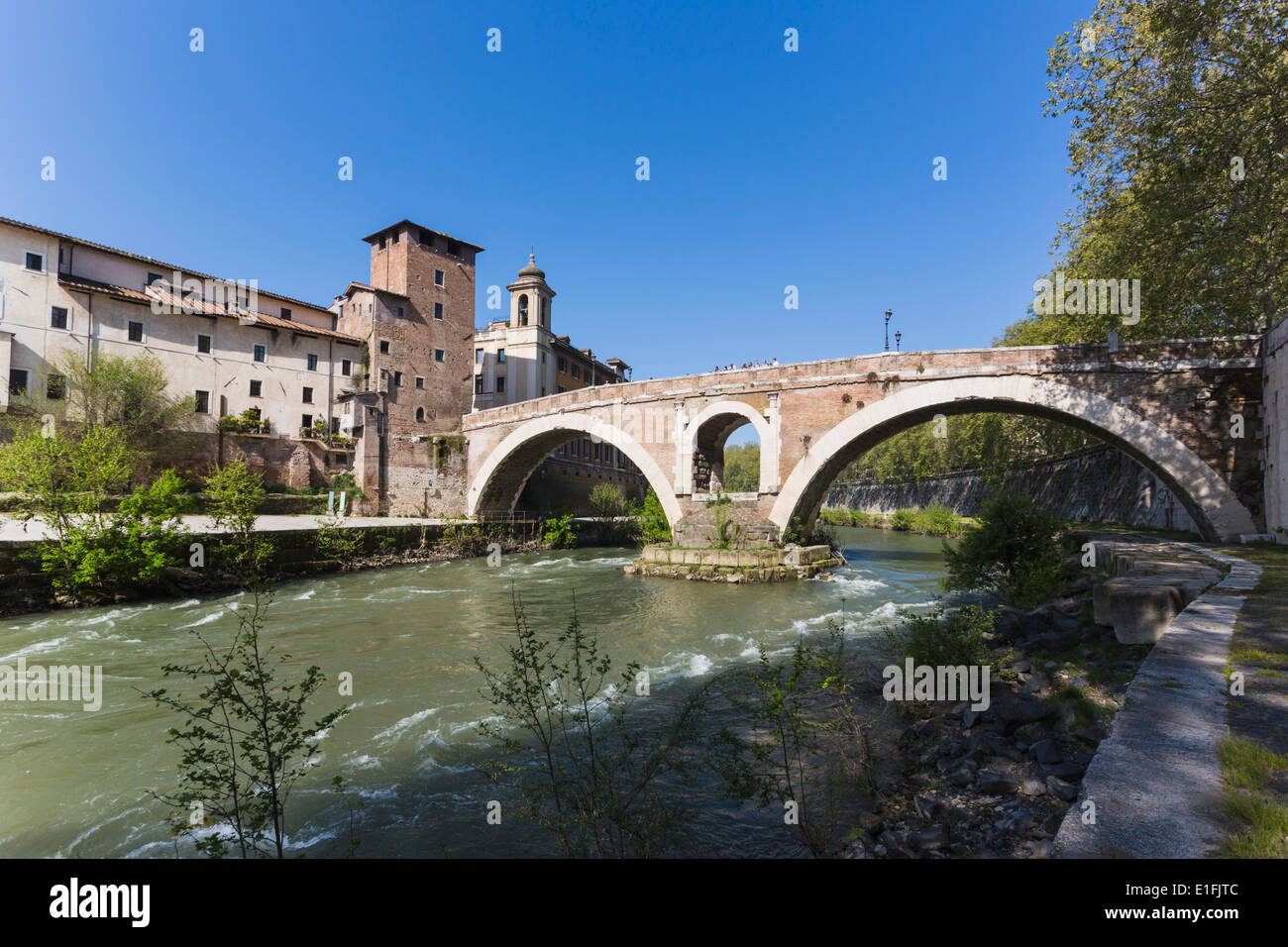 Rome, Italy. Isola Tiberina or Tiber Island with the Ponte Fabricio built in the first century BC. Stock Photo