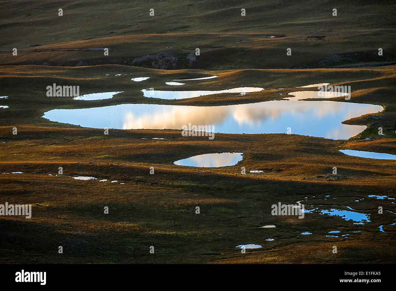 Sky reflected in a lagoon. Milluni valley. Bolivia Stock Photo