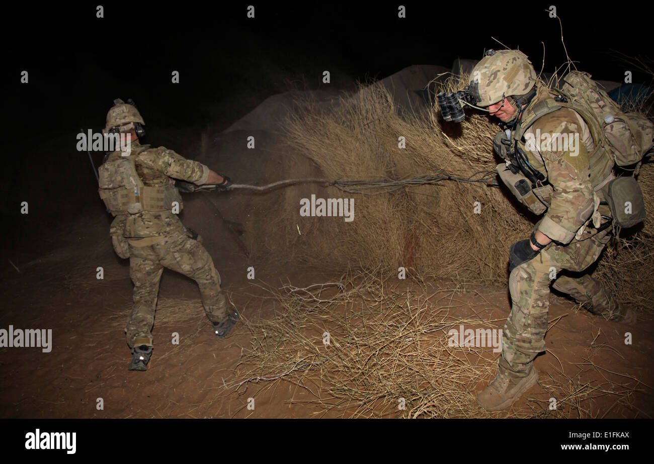 US Army soldiers conduct a nighttime search for Taliban insurgents August 8, 2013 in Zharay district, Kandahar province, Afghanistan. Stock Photo