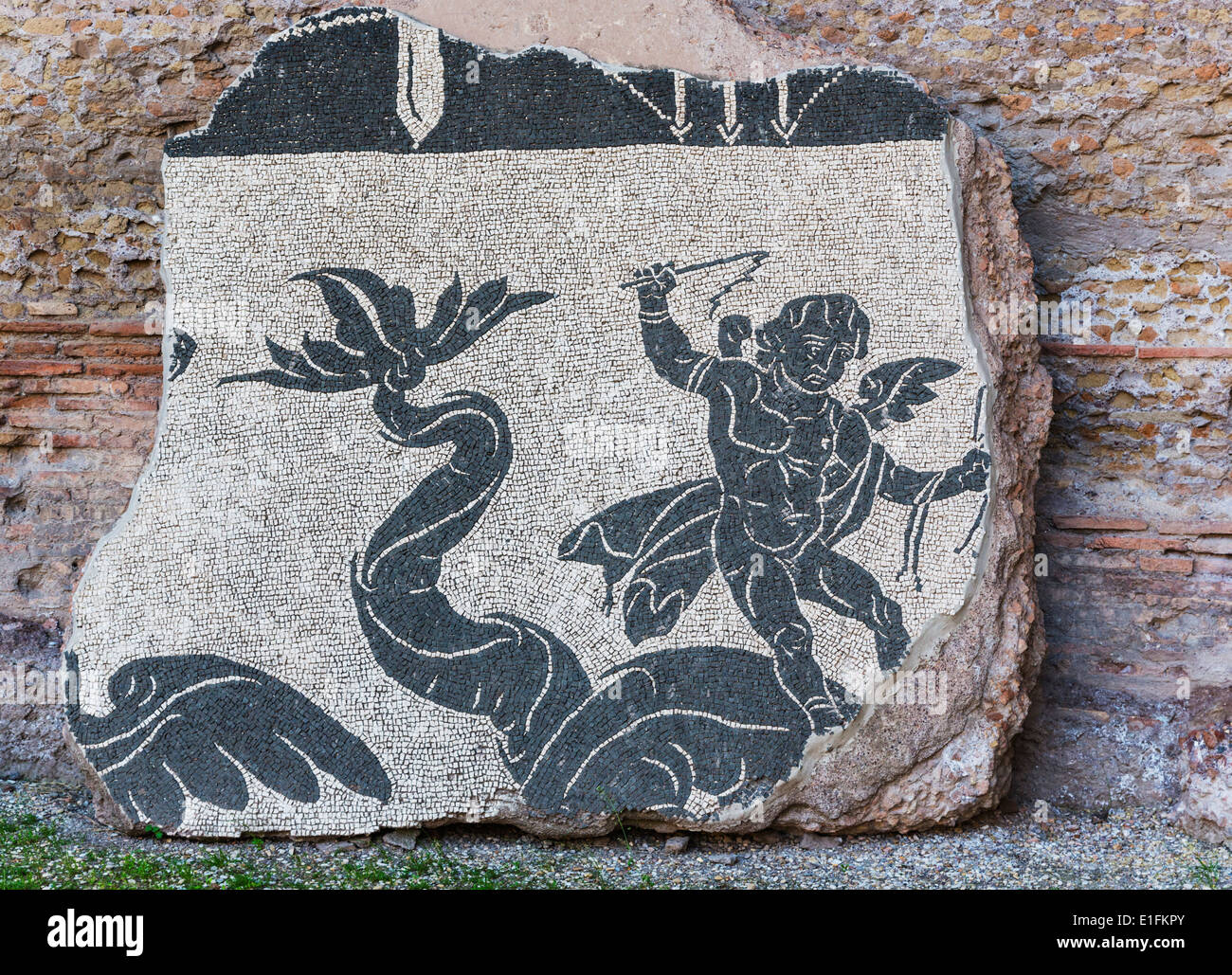 Rome, Italy. Baths of Caracalla. Fragment of mosaic in the Palaestra, boy riding what may be a dolphin. Stock Photo