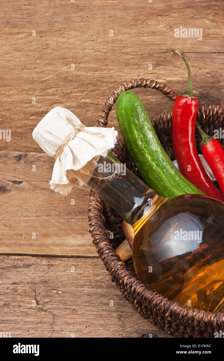 vegetables and a bottle of cooking oil in a basket Stock Photo