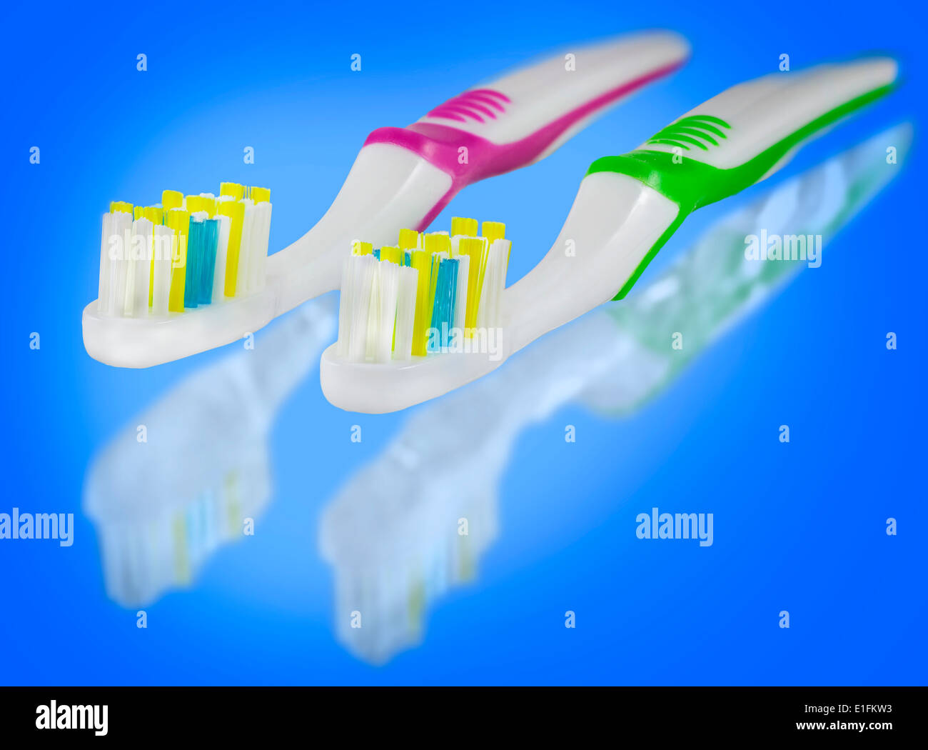 Tooth brushes on blue background. Stock Photo