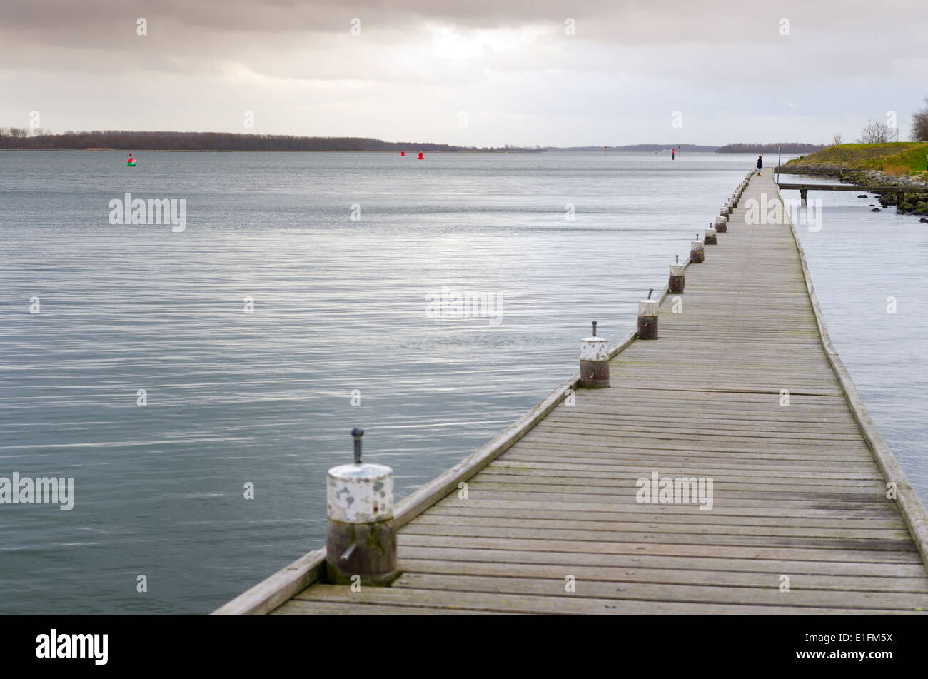 long wooden pier at the 'Veerse meer' in the Netherlands Stock Photo