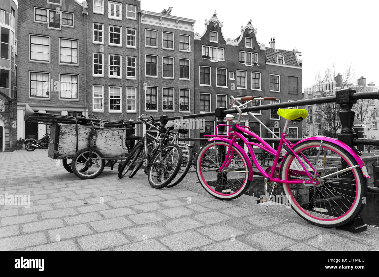 pink bicycle on a bridge in Amsterdam Stock Photo