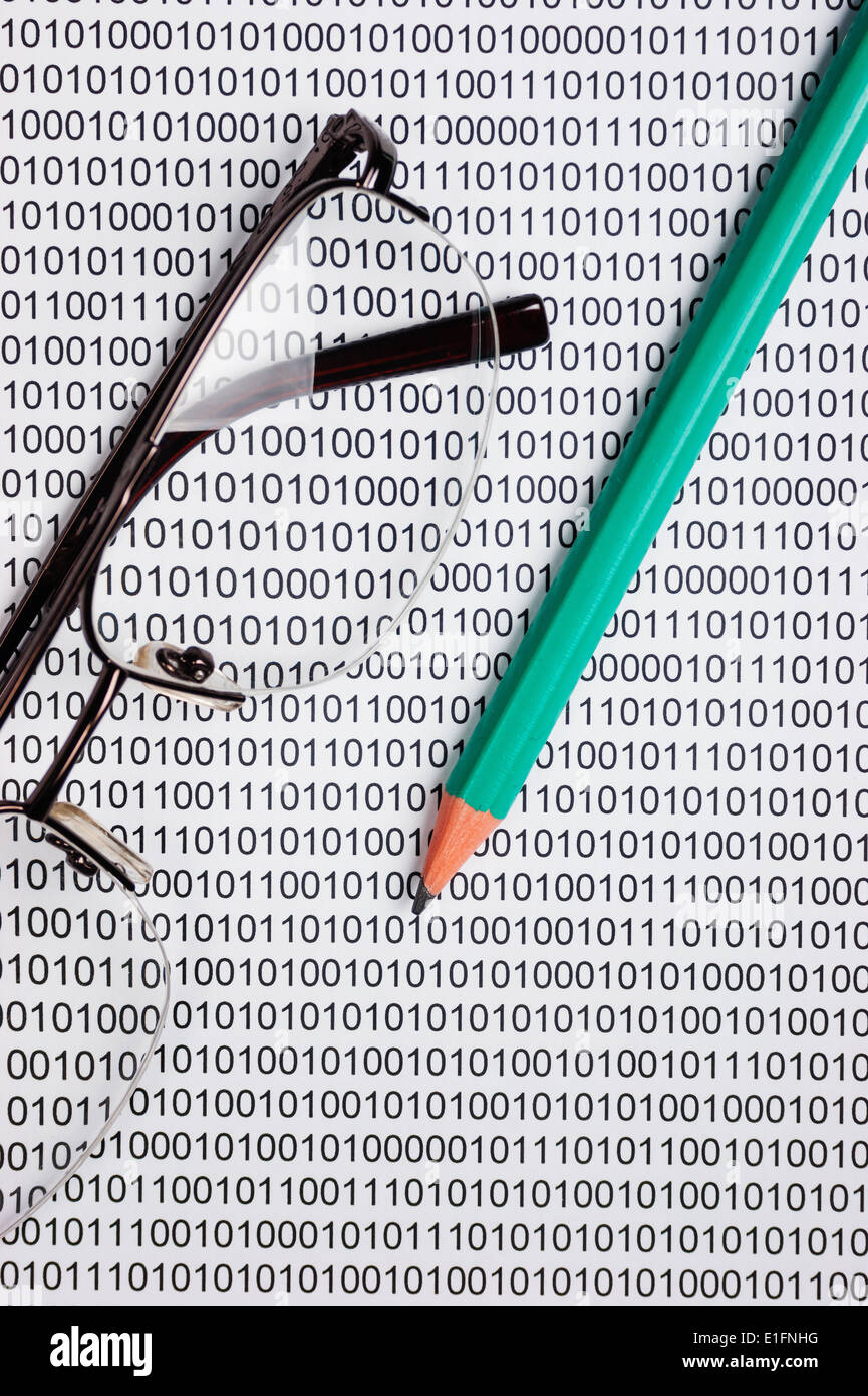 glasses and pencil on the background of a binary code Stock Photo