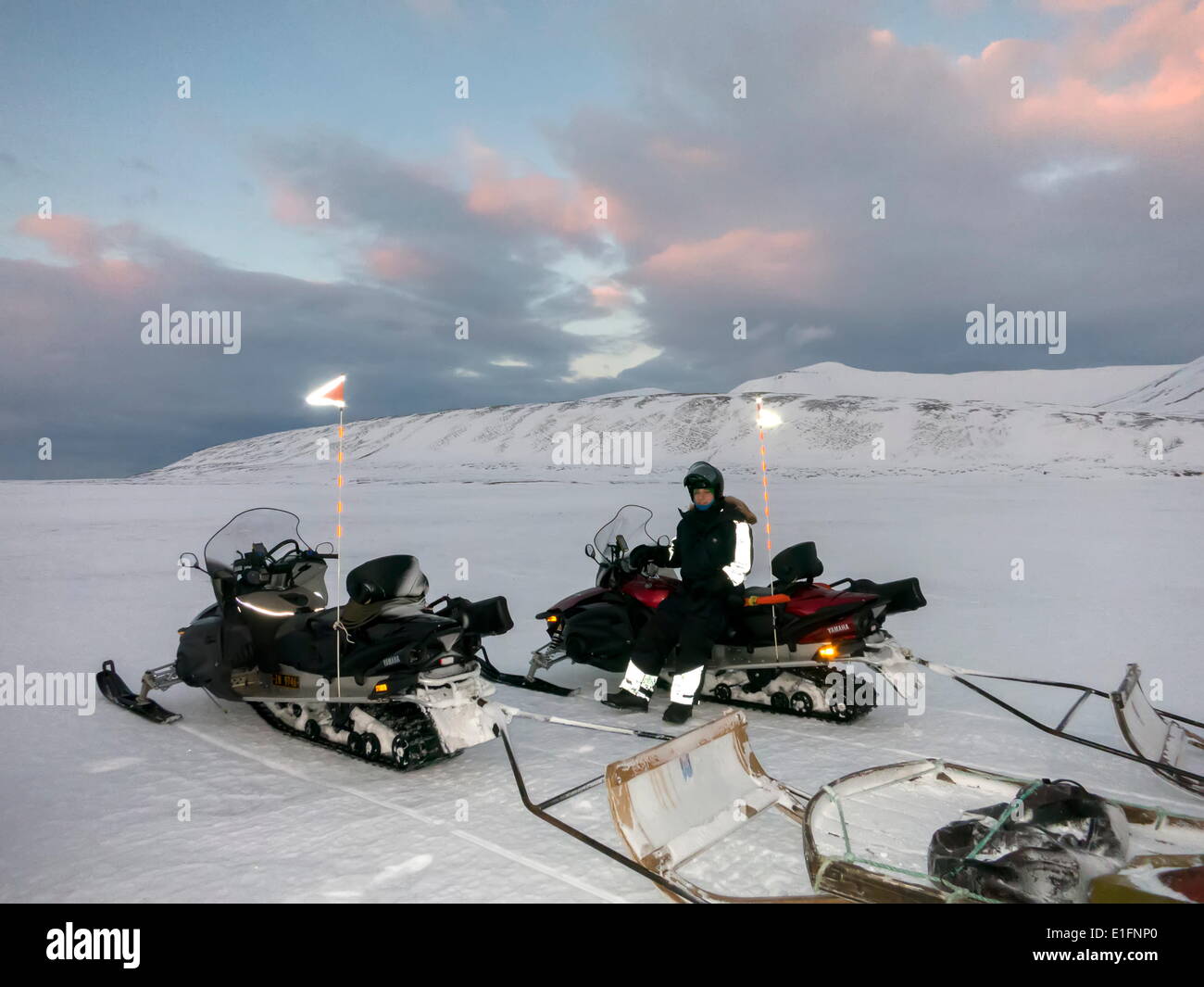 Tourists on snowmobiles (skidoos) near Barentsburg, Svalbard, Arctic, Norway, Scandinavia, Europe Stock Photo