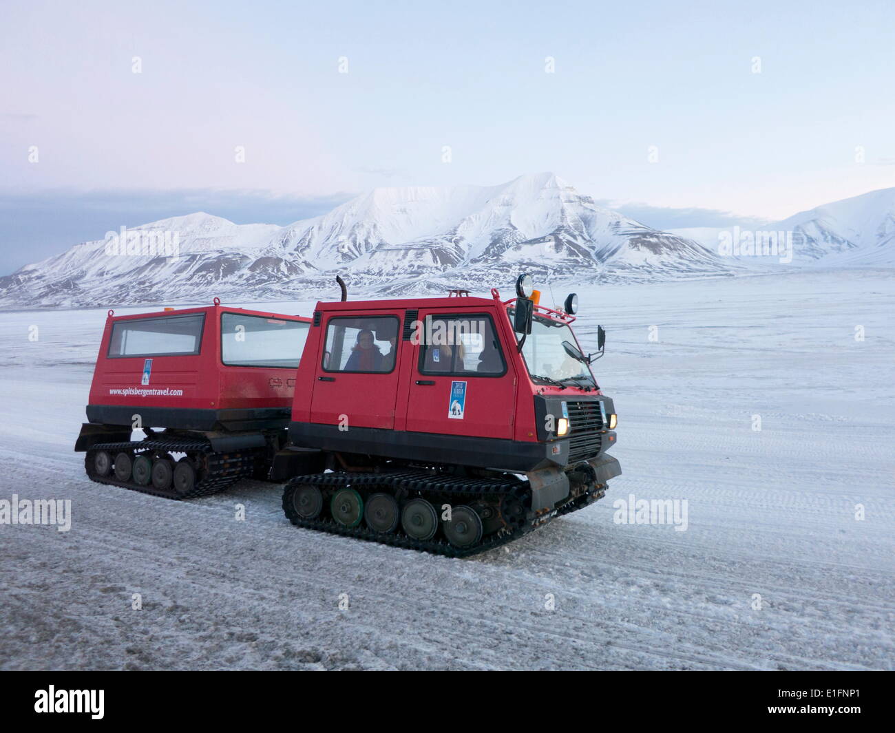 A snowcat vehicle is used for visitors and tourists to view landscapes protected from the winter cold, Svalbard, Arctic, Norway Stock Photo