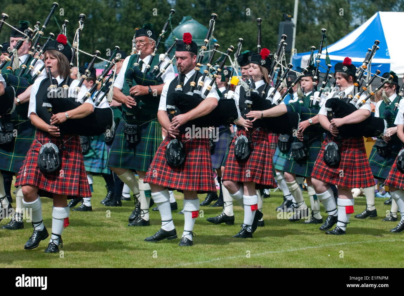 Massed pipers of the Dufftown and District pipe band, Scottish Highland Games, Scotland, United Kingdom, Europe Stock Photo