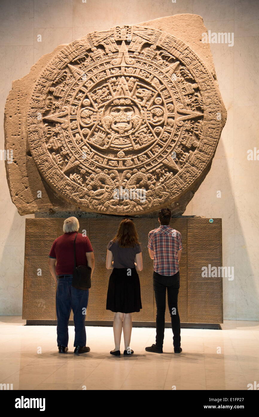 Tourists looking at Aztec calendar stone, National Museum of