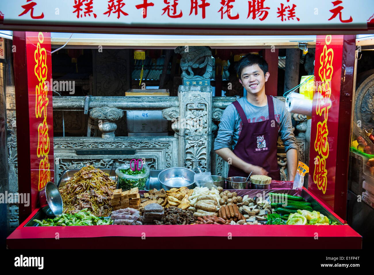 Young man in a food stall, Shilin Night Market, Taipei, Taiwan, Asia Stock Photo