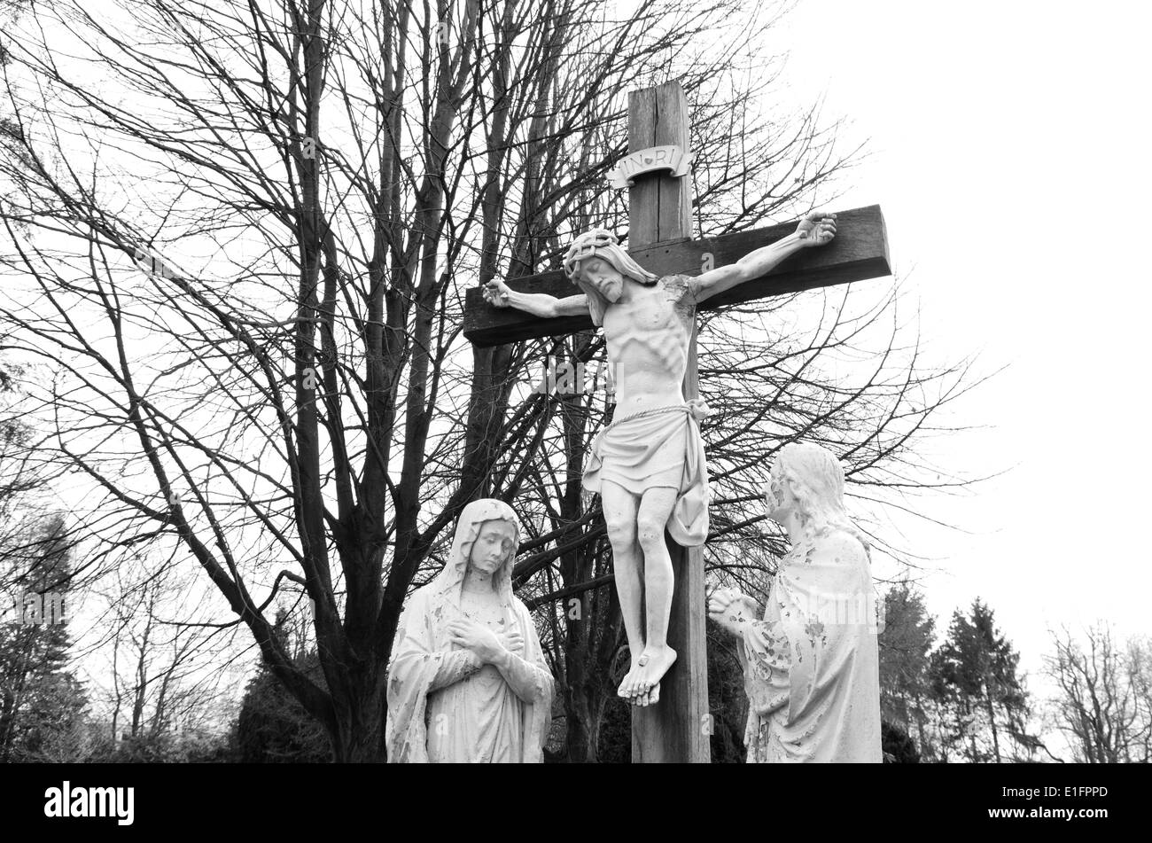 jesus crucifix statue on a graveyard Stock Photo