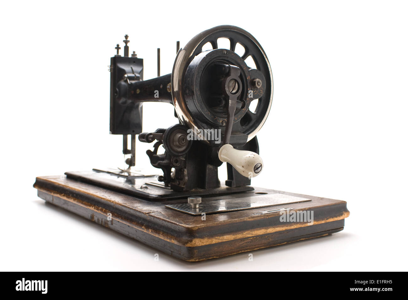Old sewing machine isolated on a white background Stock Photo - Alamy
