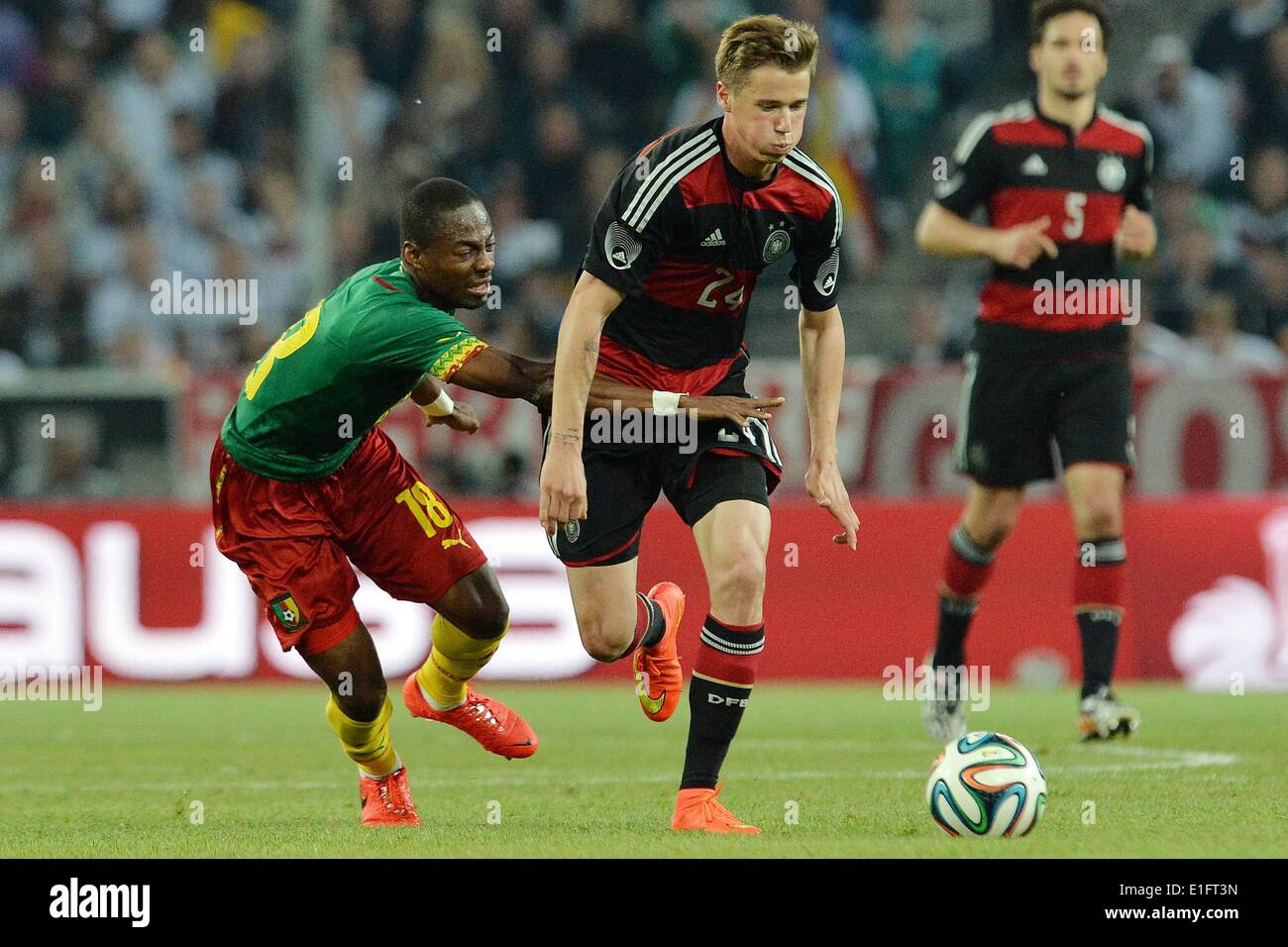 Borussia Park Moenchengladbach, Germany. 01st June, 2014. International football friendly Germany versus Cameroon preparations for the FIFA World Cup 2014 in Brazil. Eyong Enoh Cameroon left against Erik Durm Germany Credit:  Action Plus Sports/Alamy Live News Stock Photo