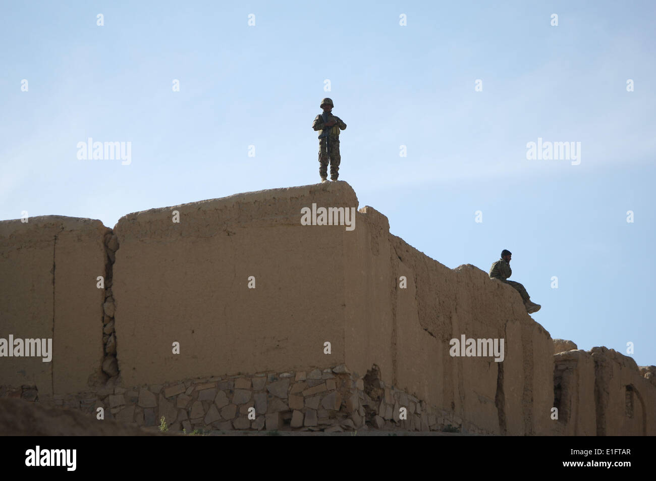 Ghor, Afghanistan. 2nd June, 2014. Afghan soldiers keep watch on the houses during an election campaign in Ghor province, Afghanistan, on June 2, 2014. The runoff between Afghan presidential candidate Abdullah Abdullah and former Finance Minister Ashraf Ghani Ahmadzai is slated for June 14 and the final results will be announced on July 22. Credit:  Ahmad Massoud/Xinhua/Alamy Live News Stock Photo