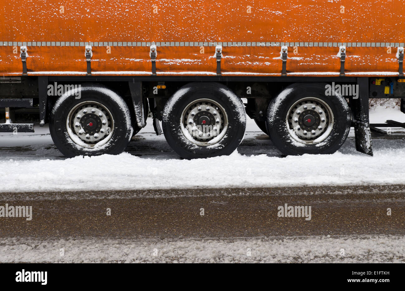 wheels of a parked trailer in winter Stock Photo