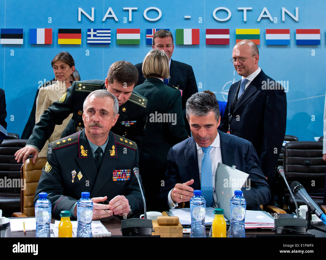 Brussels, Belgium. 03rd June, 2014. NATO Secretary General Anders Fogh Rasmussen (R) and Ukraine's Defence Minister Mikhail Koval sit during the meeting of NATO defence ministers in Brussels, Belgium, 03 June 2014. The defence ministers of the 28 member states of NATO discuss a stronger military presence in the east-European member states in light of the current crisis in the Ukraine. Photo: BERND VON JUTRCZENKA/DPA/Alamy Live News Stock Photo