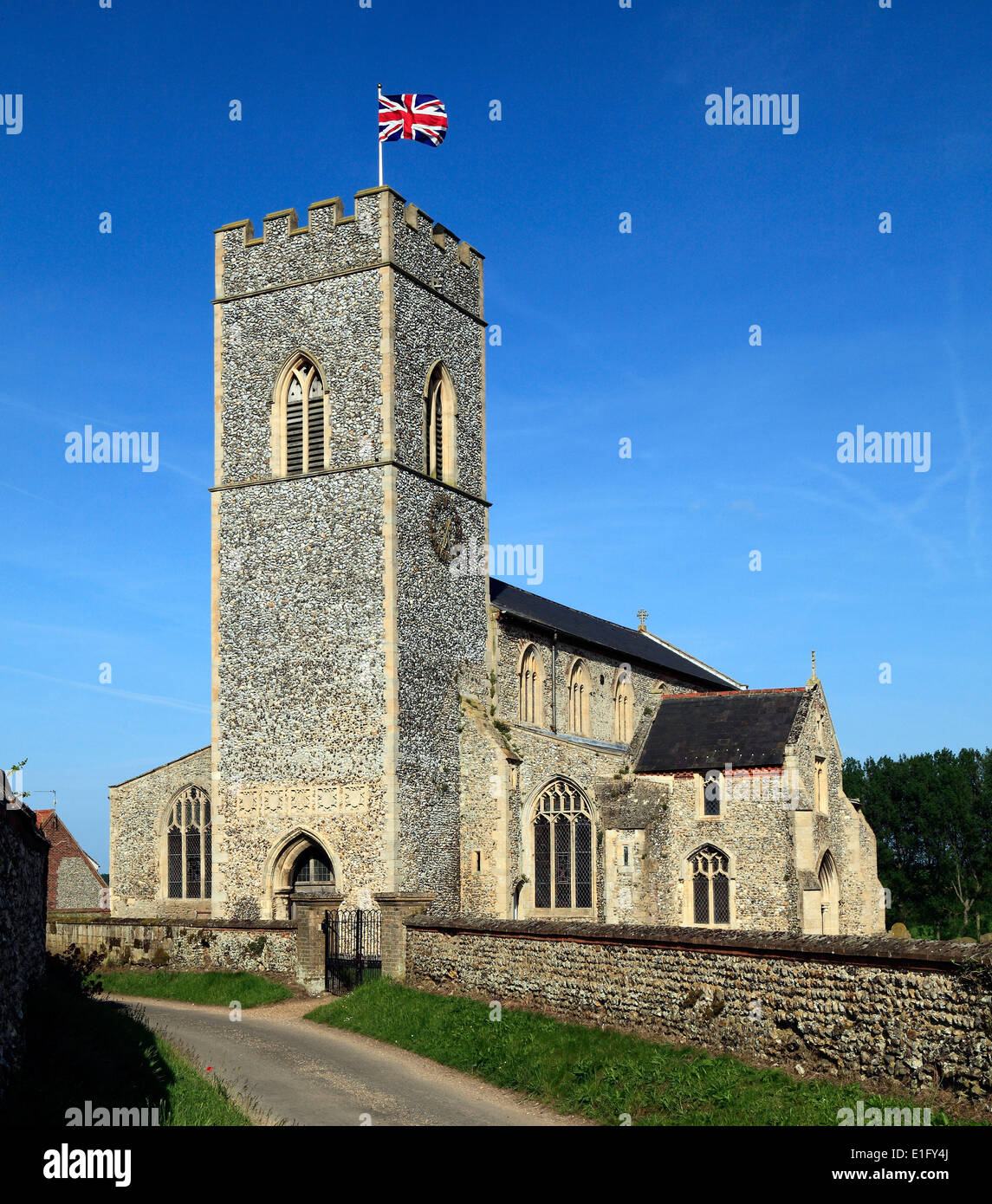 English Medieval church, Union Jack Flag, Wighton, Norfolk England UK English churches tower towers flying flags Stock Photo