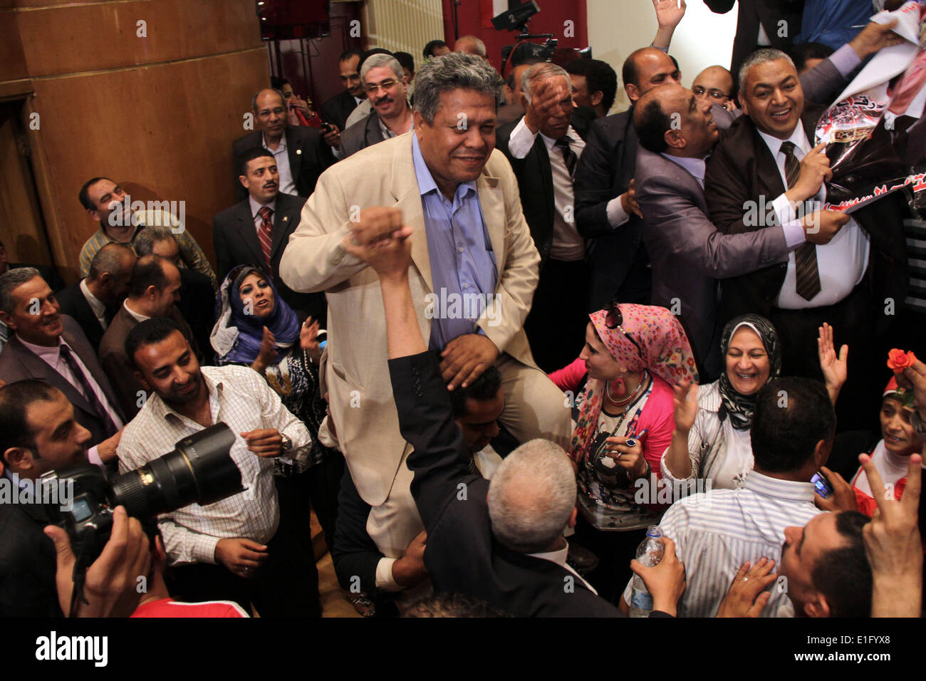 Cairo, Egypt. 3rd June, 2014. Egyptian journalists and State Information Service (SIS) employees celebrate at the end of a press conference in the capital Cairo on June 3, 2014, in which the electoral commission announced that Ex-army chief Abdel Fattah al-Sisi won 96.9 percent of votes in Egypt's presidential election. Sisi rival Hamdeen Sabbahi won just three percent of the vote, excluding spoiled ballots Credit:  Mohammed Bendari/APA Images/ZUMAPRESS.com/Alamy Live News Stock Photo
