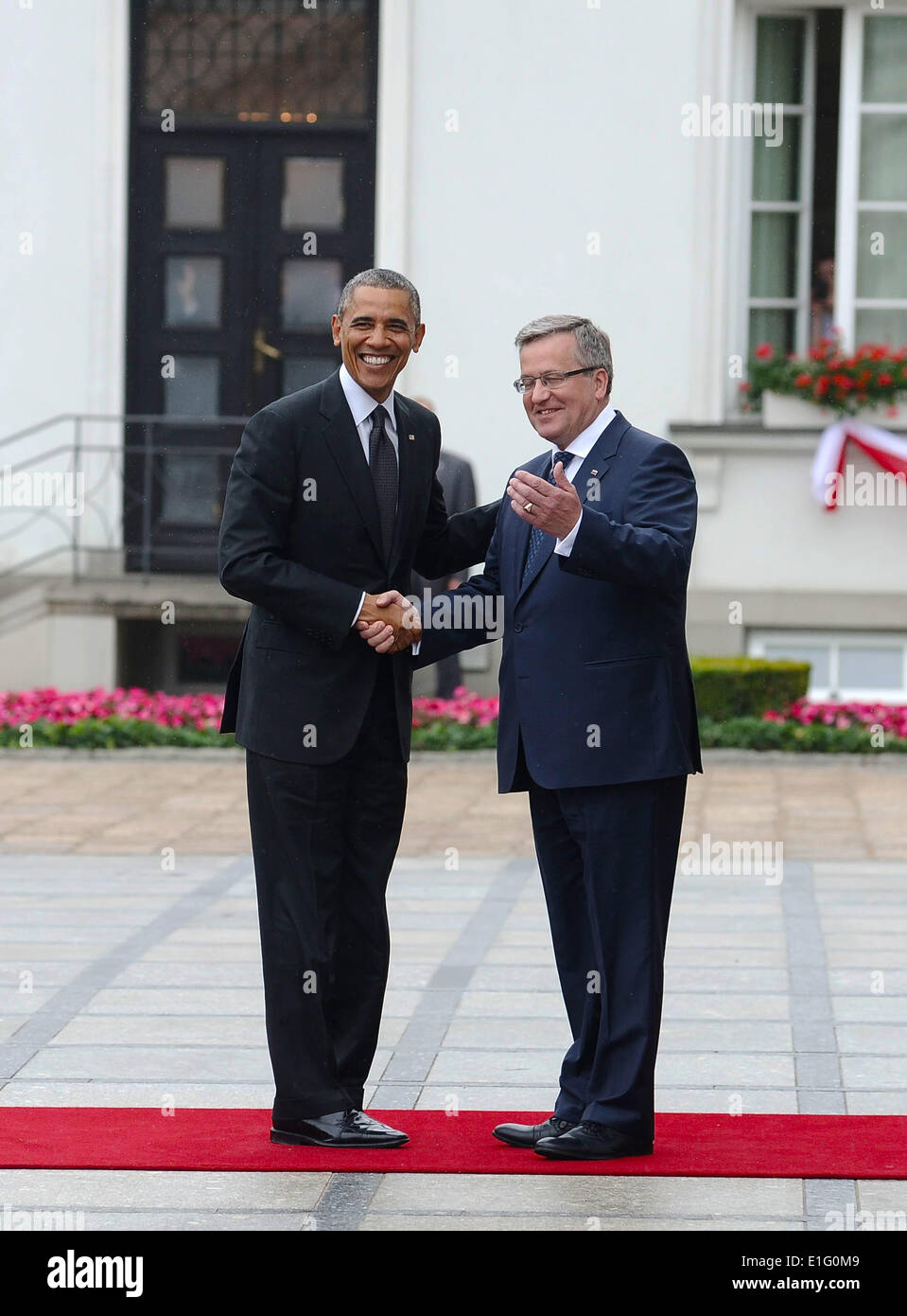 US President Barack Obama shakes hands with Polish President Bronislaw Komorowski at the Belweder Palace June 3, 2014 in Warsaw, Poland. The president's visit to Warsaw coincides with the 25th anniversary of Poland emerging from communism. Stock Photo