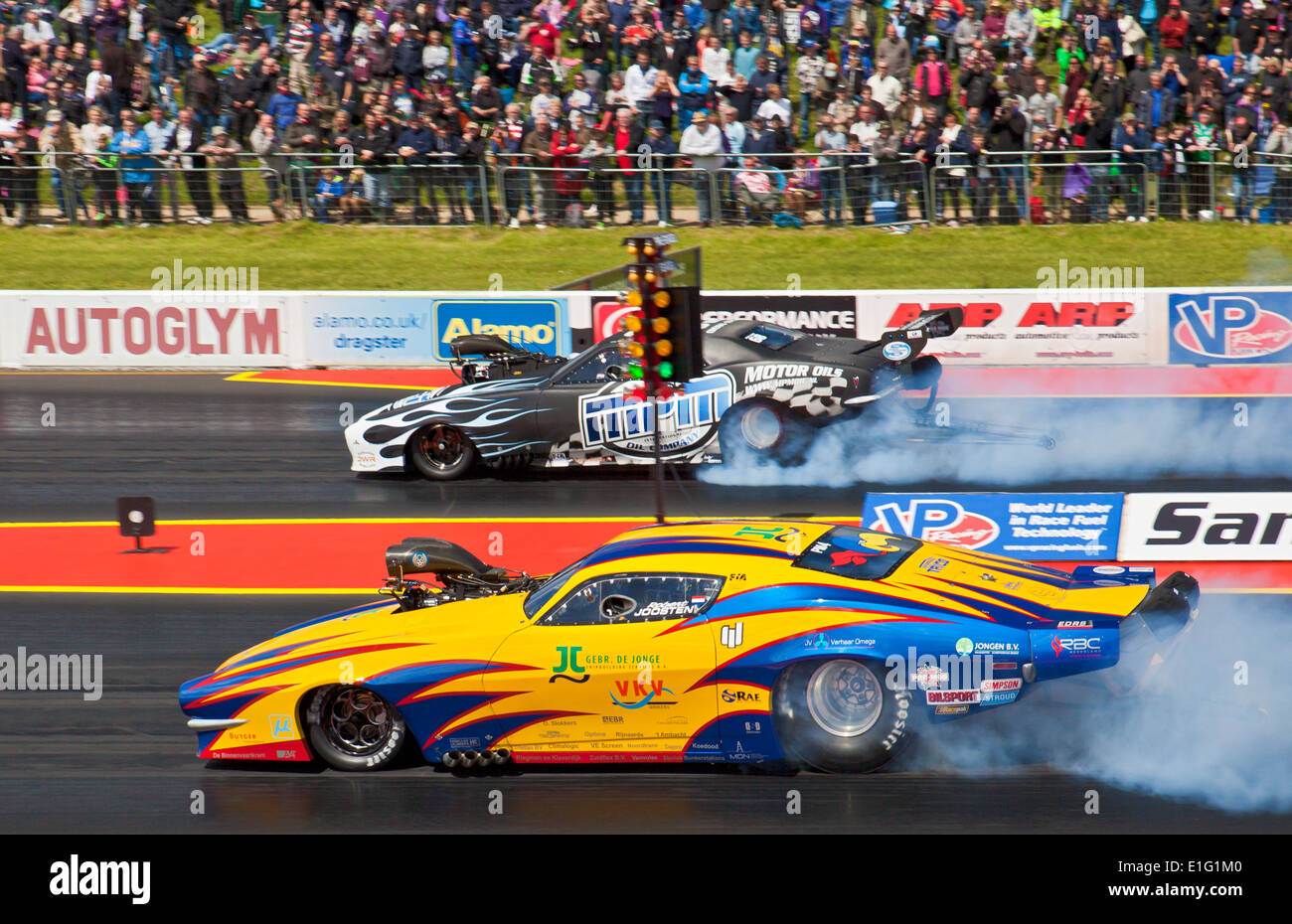 Pro Mod cars drag racing at Santa Pod. Robert Joosten nearside Marc Meihuizen far side. Stock Photo