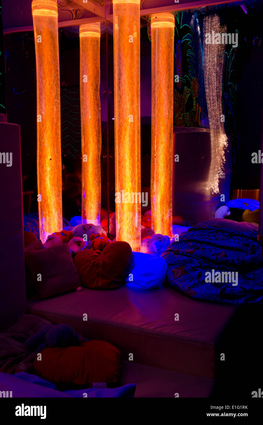 Bubble towers and fibre optic lighting in a disability charity sensory room - orange (2/4) Stock Photo