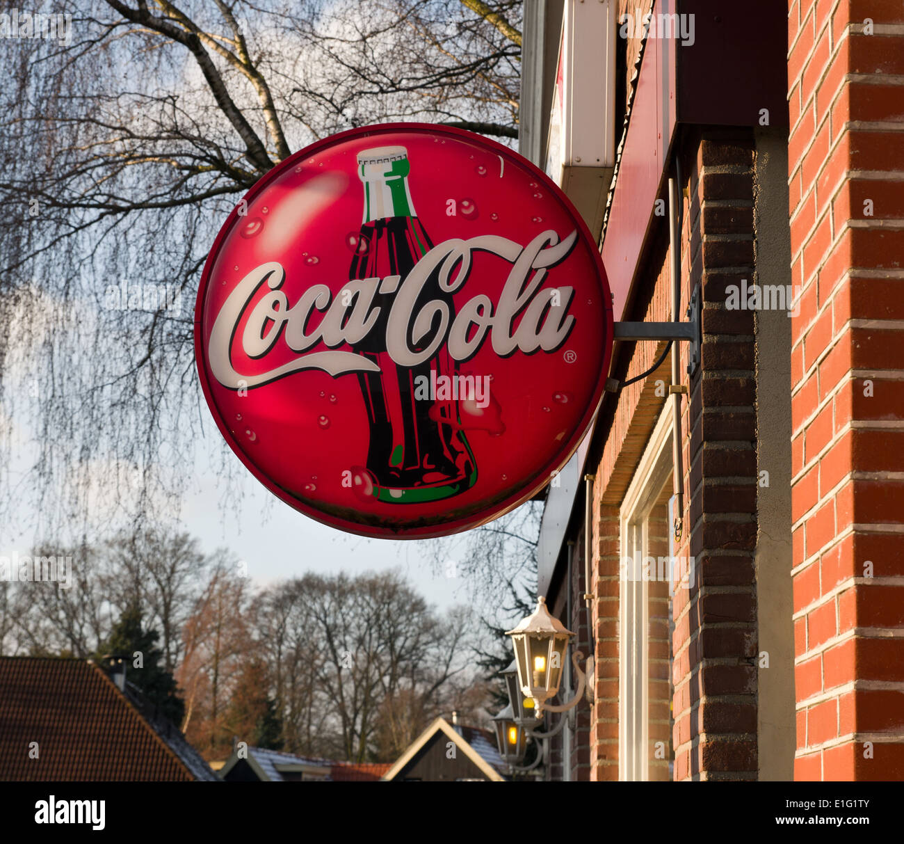 coca-cola advertisement shield on the facade of a cafe Stock Photo