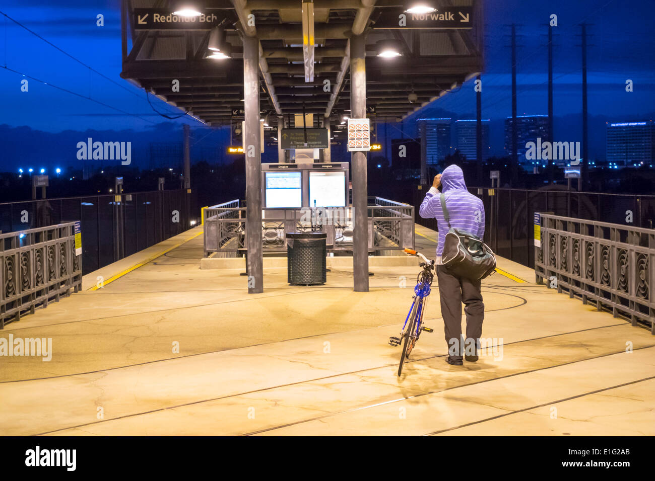 Los Angeles California,LA County Metro Rail,urban rail system,mass transit,Douglas Station,platform,evening,lighting,man men male,commuter,bicycle,bic Stock Photo