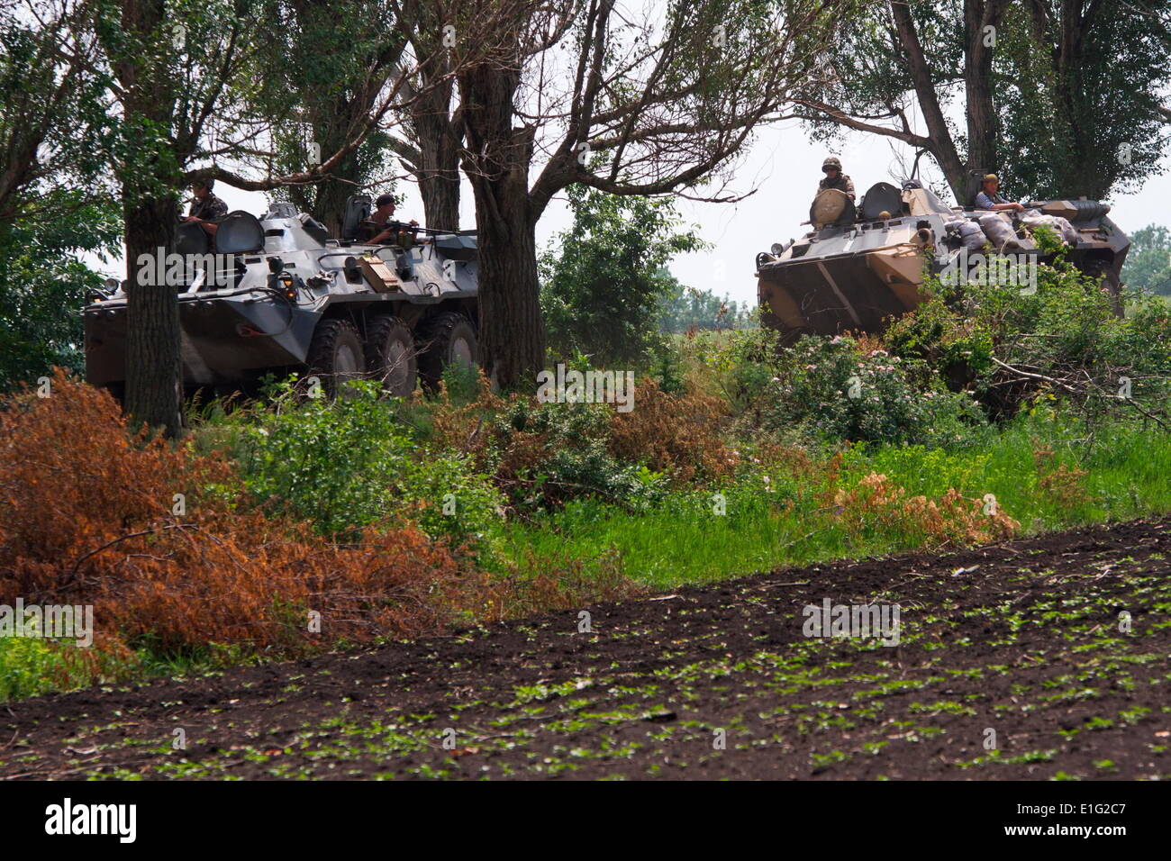 Donbas, Ukraine. 30th May, 2014. Military APC's patrol. The White House expressed concern Thursday that pro-Russian separatists in Donbas (Ukraine) were using advanced weapons ''from the outside'' after they shot down an army helicopter killing 12 soldiers. © Sergii Kharchenko/NurPhoto/ZUMAPRESS.com/Alamy Live News Stock Photo