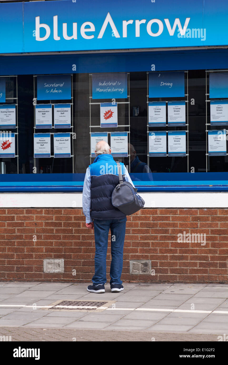 Man looking at job adverts at blueArrow, Bristol in May Stock Photo