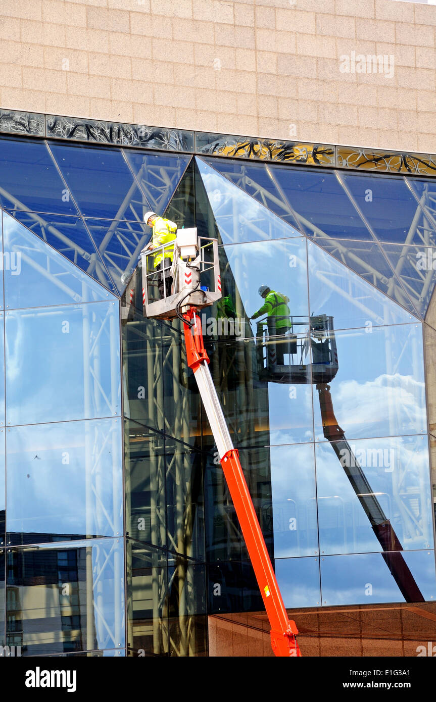 Window cleaner cleaning the windows of the International Convention