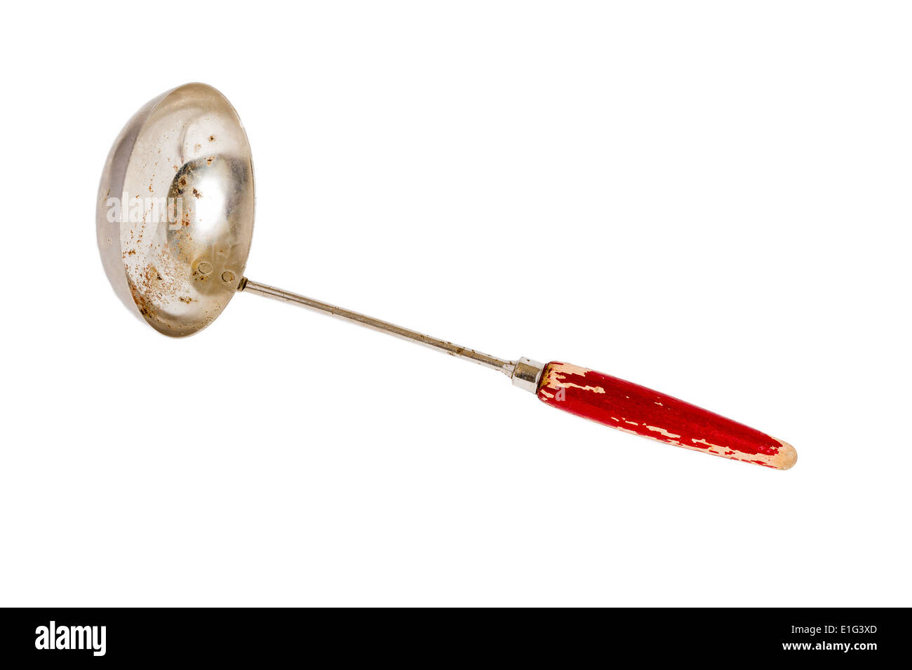 Antique ladle with a red wooden handle on a solid white background Stock Photo