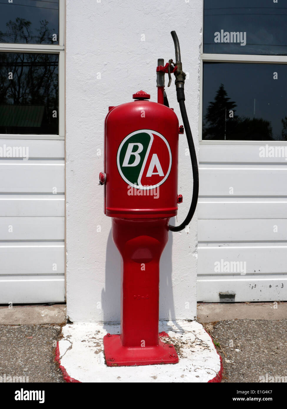 A British American Antique Gas Pump Outside A Historic Gas Station In