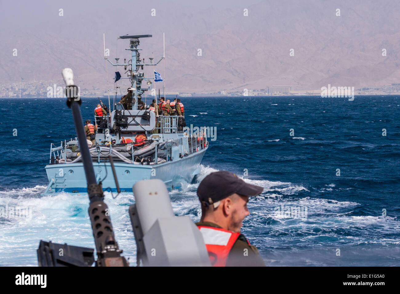 Israel. Navy patrol boats near the city of Eilat and the Israeli-Jordanian border. The city of Aqaba in the background. Stock Photo