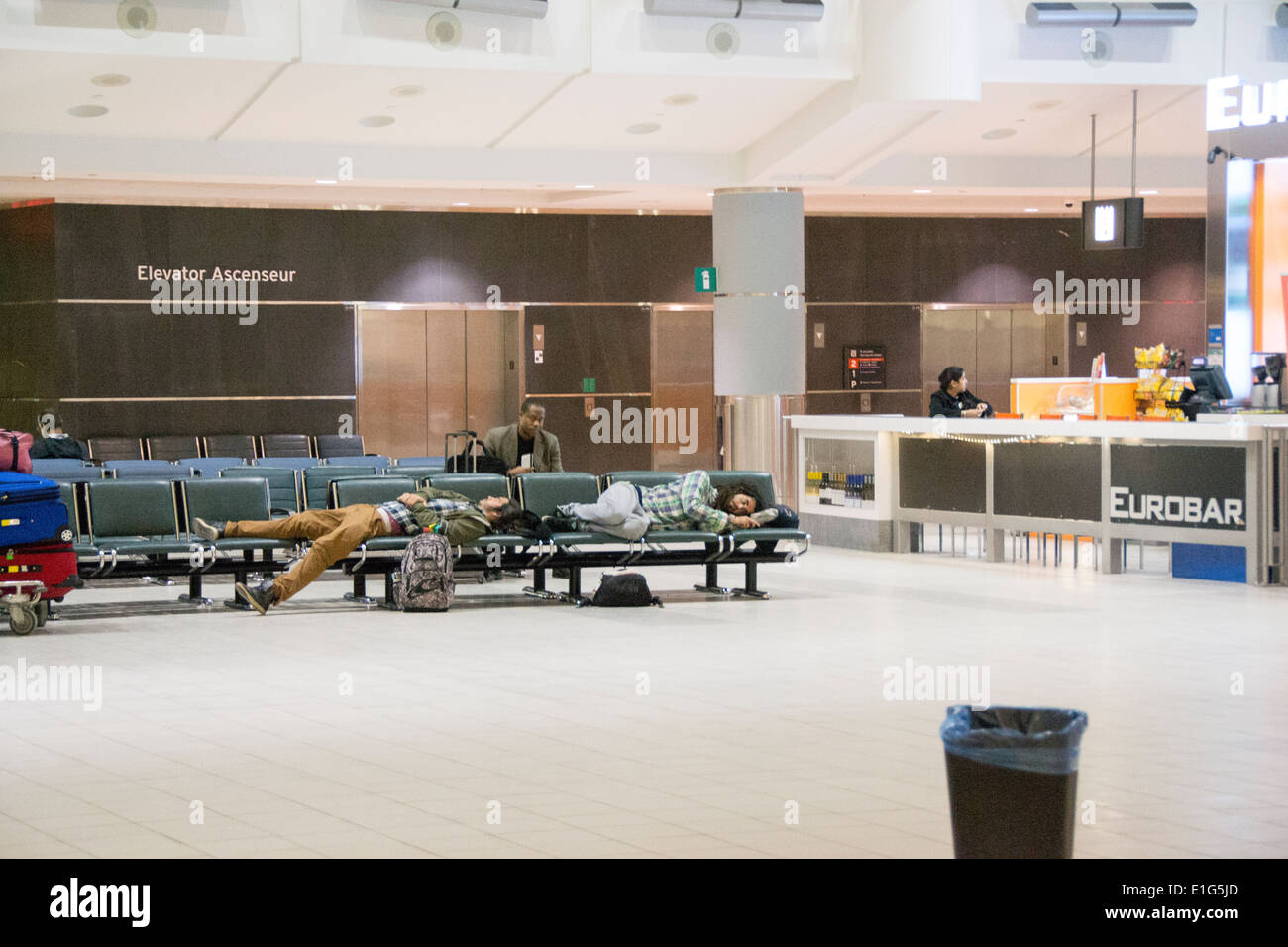 Travelers sleeping in Pearson Airport in Toronto as winter weather causes misery across much of Canada, with southern Ontario Stock Photo