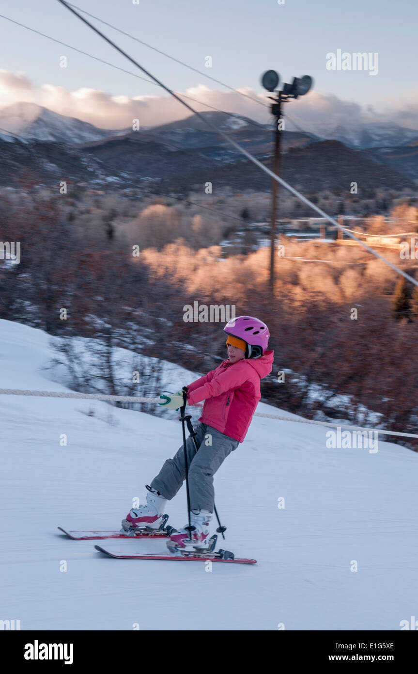 A young girl riding a rope tow at Chapman Hill Ski Area, Durango